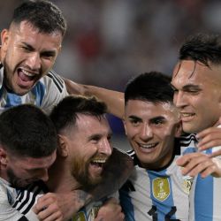 Argentina's forward Lionel Messi (centre) celebrates with midfielder Leandro Paredes, Rodrigo De Paul, Thiago Almada and Lautaro Martínez after scoring a goal during the friendly match between the Albiceleste and Panama at the Monumental in Buenos Aires, on March 23, 2023. 