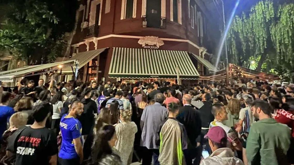 Fans wait to catch a glimpse of Lionel Messi outside the Don Julio parrilla in Buenos Aires.