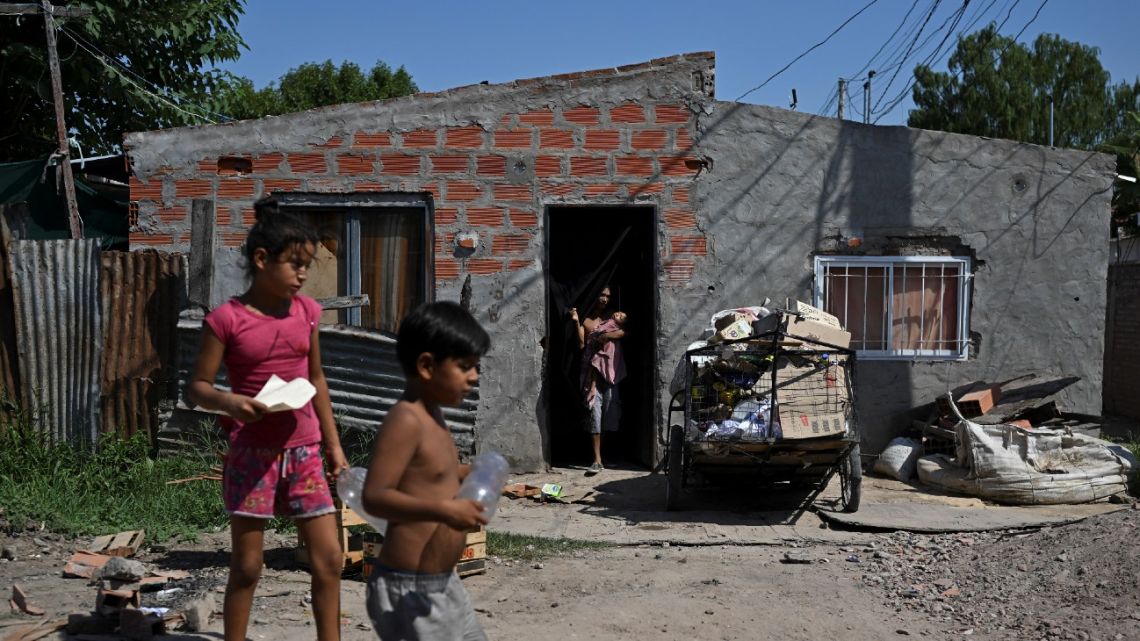 Children are seen on the street in the Los Pumitas neighbourhood in Rosario, Santa Fe Province, on March 15, 2023