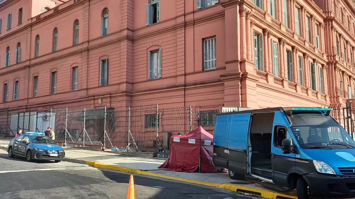 A red gazebo is erected just metres from the Casa Rosada, covering the body of the dead three-month-old baby.
