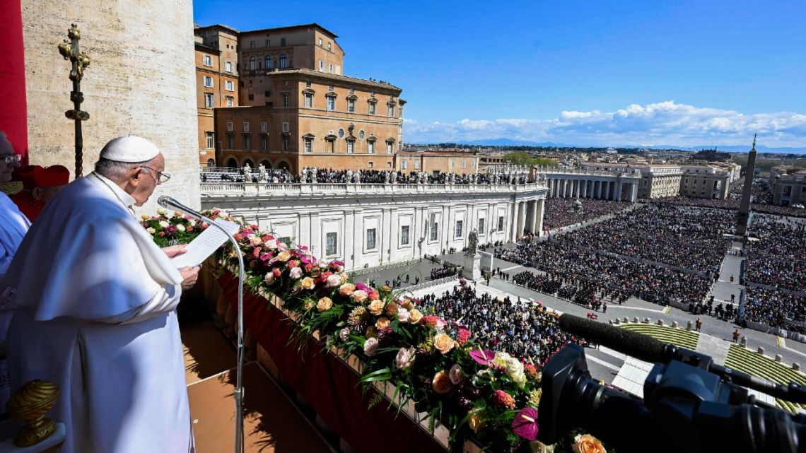 This photo taken and issued as a handout on April 9, 2023 by the Vatican Media shows Pope Francis addressing attendees, prior to deliver the Urbi et Orbi message and blessing for Easter from the loggia of St. Peter's basilica overlooking St. Peter's square in The Vatican. 