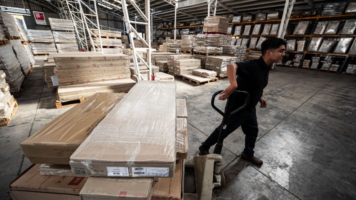 An employee of the Chilean company Homemobili works at the facilities in Santiago on March 29, 2023. 