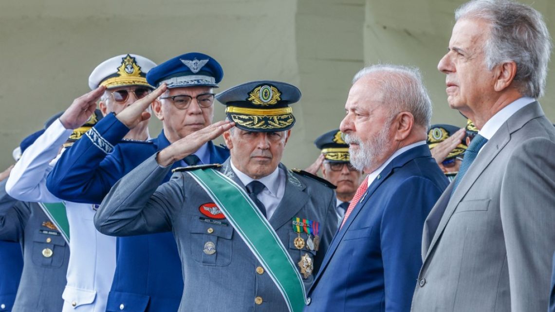 Brazil's President Luiz Inacio Lula da Silva (2-R) and Defense Minister Jose Mucio Monteiro (R) receiving salutes from the Armed Forces Chiefs, Lula leaves Thursday for his Europe trip.