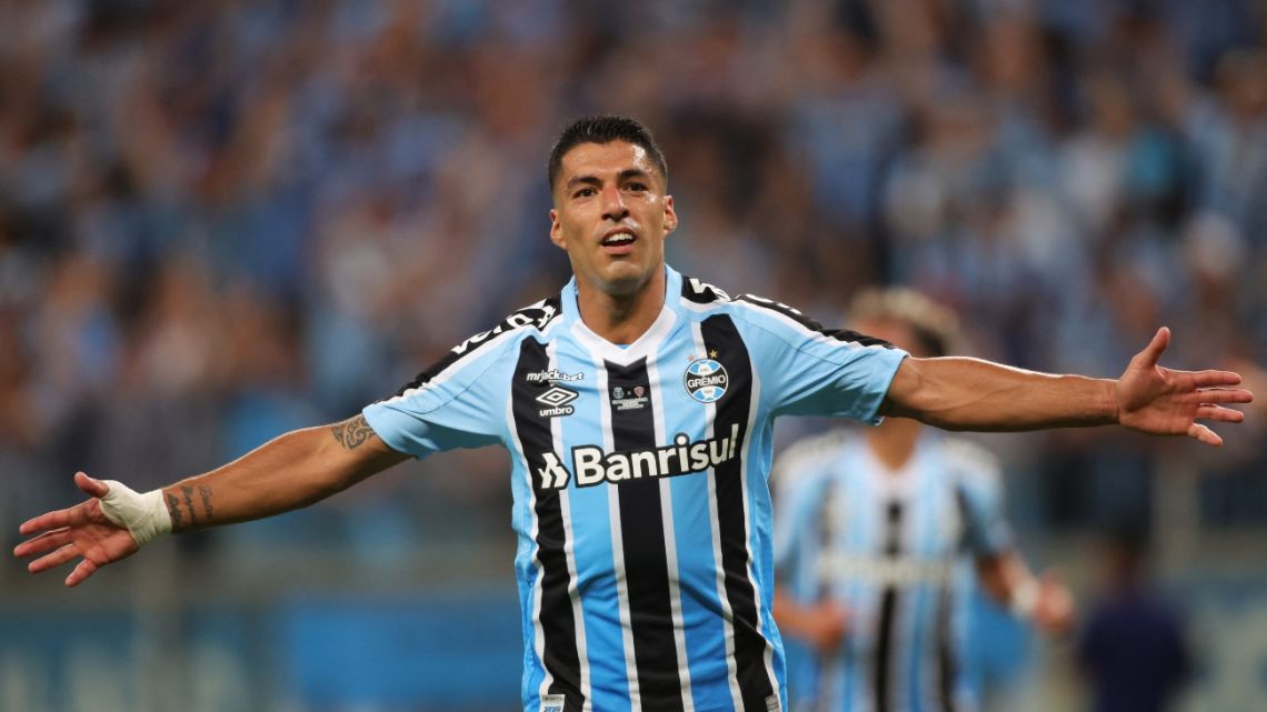 Gremio's Uruguayan forward Luis Suarez celebrates after scoring against Sao Luiz during the Brazilian Recopa Gaucha football match between Gremio and Sao Luiz at the Arena do Gremio stadium in Porto Alegre, Brazil.