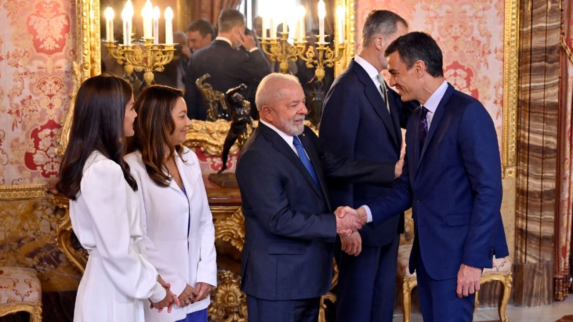 Spanish Prime Minister Pedro Sánchez (right) shakes hands with Brazilian President Luiz Inácio Lula da Silva and his wife Brazilian sociologist Rosangela 'Janja' da Silva (second left) during a royal audience with King Felipe VI of Spain and Queen Letizia (left) at the Royal Palace in Madrid on April 26, 2023.