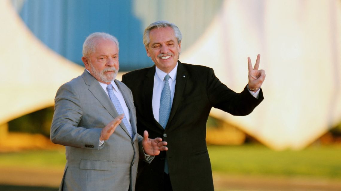 Brazilian President Luiz Inácio Lula da Silva greets Argentina's President Alberto Fernández at the Alvorada Palace in Brasília on May 2, 2023. 