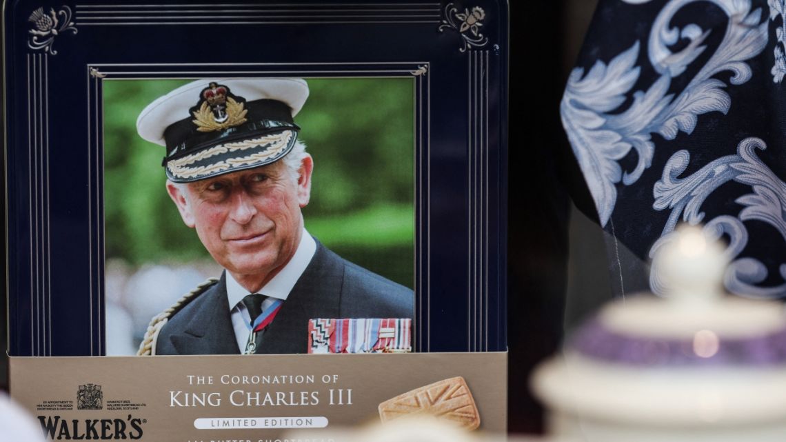 A portrait of Britain's King Charles III is displayed in the front window of a shop, in Windsor, on May 2, 2023, ahead of the coronation ceremony of Charles III and his wife, Camilla, as King and Queen of the United Kingdom and Commonwealth Realm nations, on May 6, 2023.
