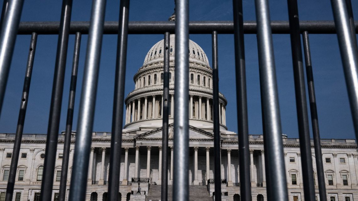 The US Capitol is seen through police barricades in Washington, DC, on May 11, 2023. 