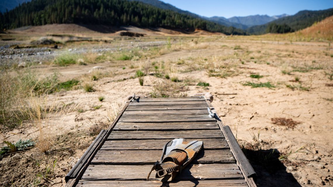 A lone flipper sits on a dried boat dock sitting at the bottom of the Stuart Fork arm of Trinity Lake during an ongoing drought in Trinity Center, California, on October 15, 2022.