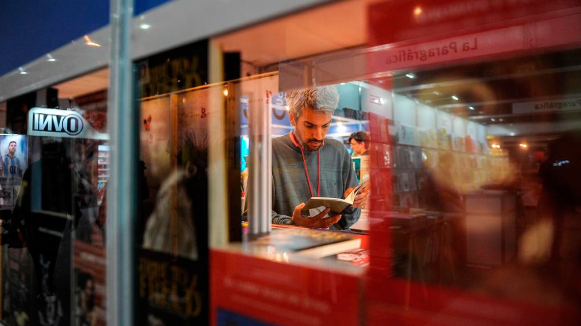 A visitor looks at a book at the Buenos Aires International Book Fair.