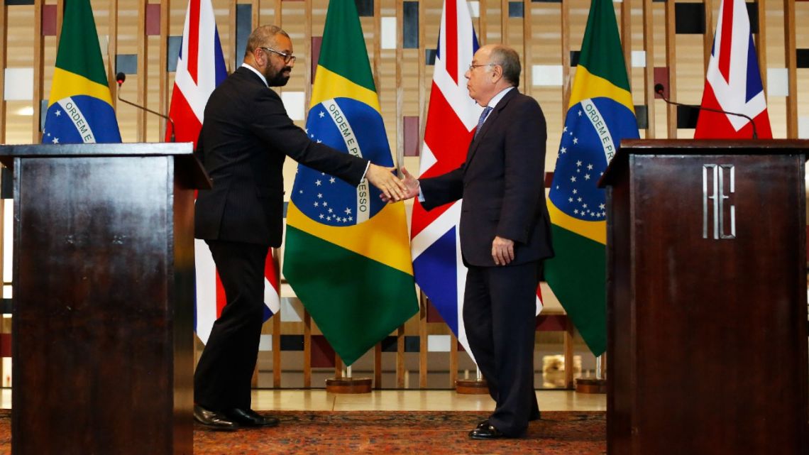 British Foreign Minister James Cleverly and Brazilian Foreign Minister Mauro Vieira shake hands during a press conference at the Itamaraty Palace in Brasilia on May 24, 2023. 