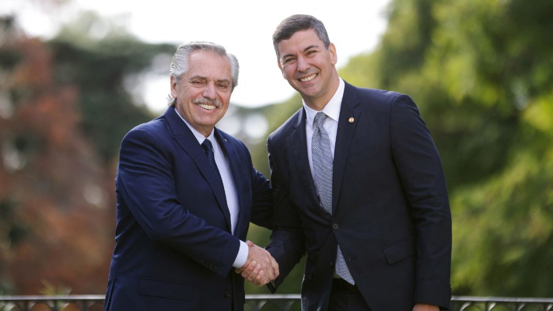 Argentina's President Alberto Fernández (left) and Paraguay's elected President Santiago Peña shaking hands during a meeting at the Olivos Presidential Residence in Olivos, Buenos Aires Province, on May 29, 2023.