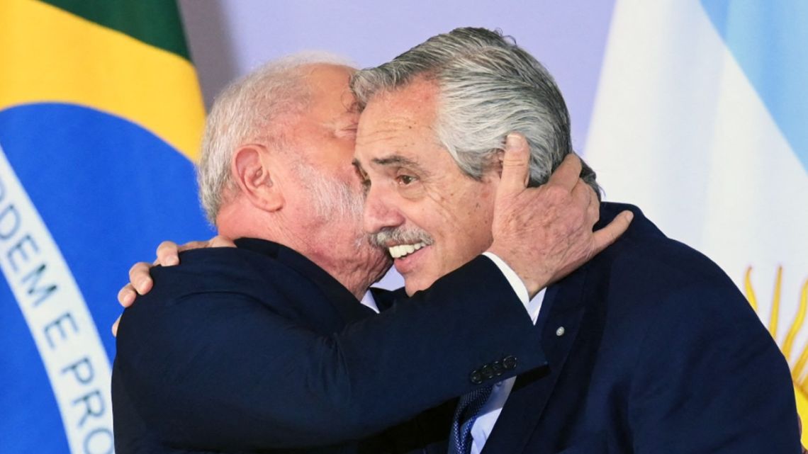 Brazil's President Luiz Inácio Lula da Silva greets Argentina's President Alberto Fernández before the family photo at the Itamaraty Palace in Brasilia on May 30, 2023.