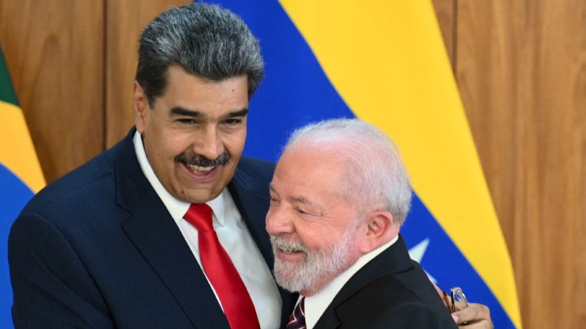 Venezuela's President Nicolás Maduro and Brazil's President Luiz Inácio Lula da Silva greet each other after a joint press conference at the Planalto Palace in Brasilia on May 29, 2023. 