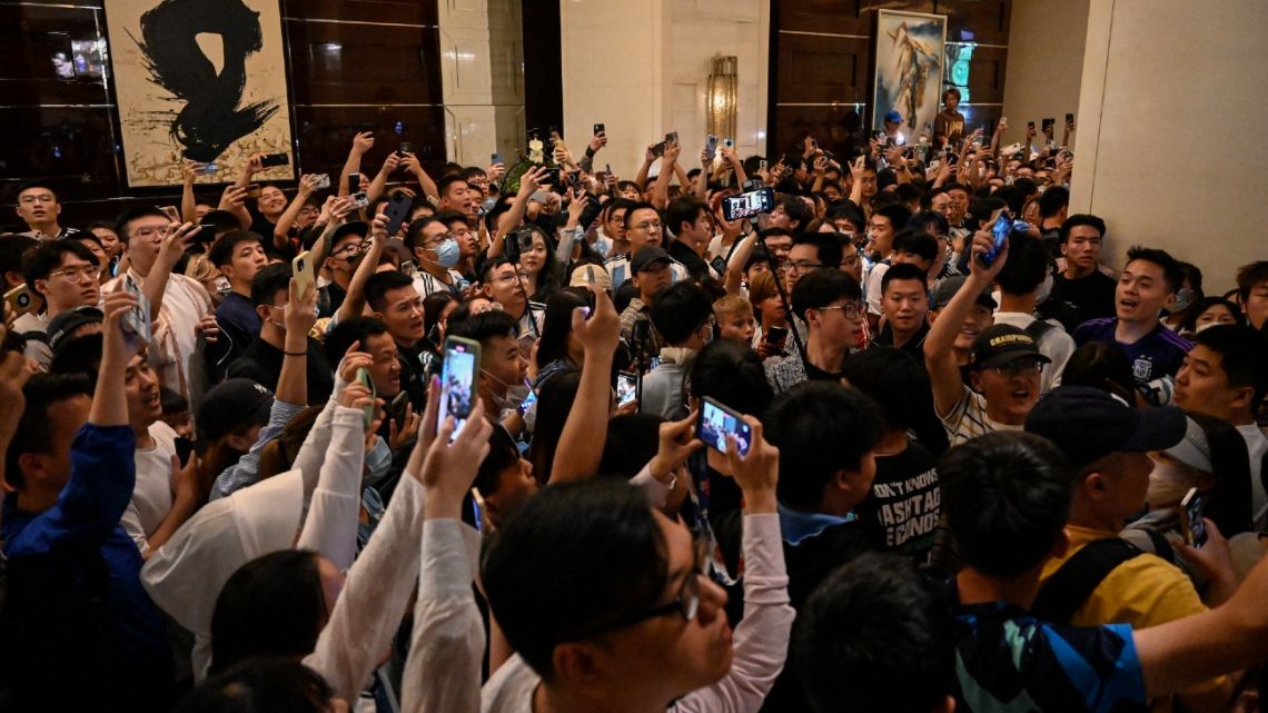 Chinese fans wait for members of Argentina's football team in the lobby of a hotel where the team is staying in Beijing on June 10, 2023.