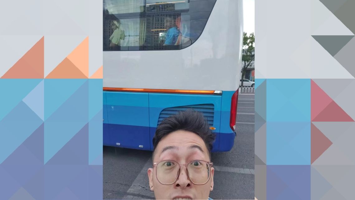 This handout picture courtesy of Liu Yuhang taken on June 11, 2023 and released to AFP on June 12 shows Liu Yuhang posing for a selfie as Argentine football player Lionel Messi (background C) is seen riding a team bus enroute to a training session, in Beijing. It took hours of waiting, a pricey hotel booking and an exhausting chase through the streets of Beijing, but it was all worth it for football superfan Liu Yuhang who finally got to glimpse his hero Lionel Messi up close. 