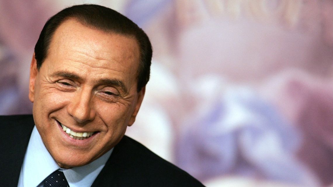 Picture taken 29 March 2006 shows then-Italy Prime Minister Silvio Berlusconi smiling during a press conference in Rome. 