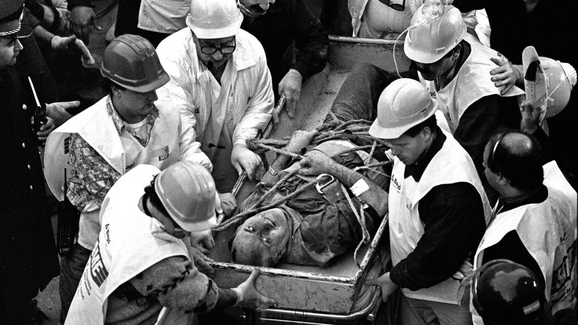 Argentine rescue workers evacuate Jacobo Chemanuel, 56, found under the rubble after 36 hours of the blast which destroyed Argentinian Israelite Mutual Association (AMIA) in Buenos Aires, killing 85 people, on July 18, 1994. 