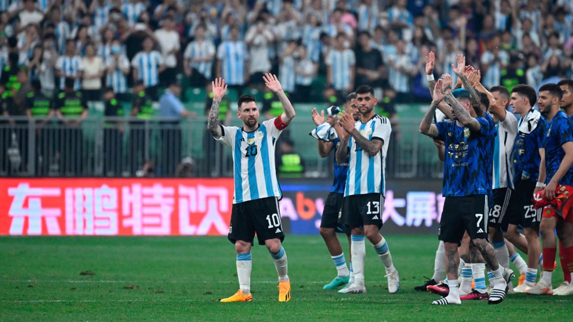 Lionel Messi leads Argentina's players as they wave to his fans during a friendly football match against Australia at the Workers' Stadium in Beijing on June 15, 2023. 