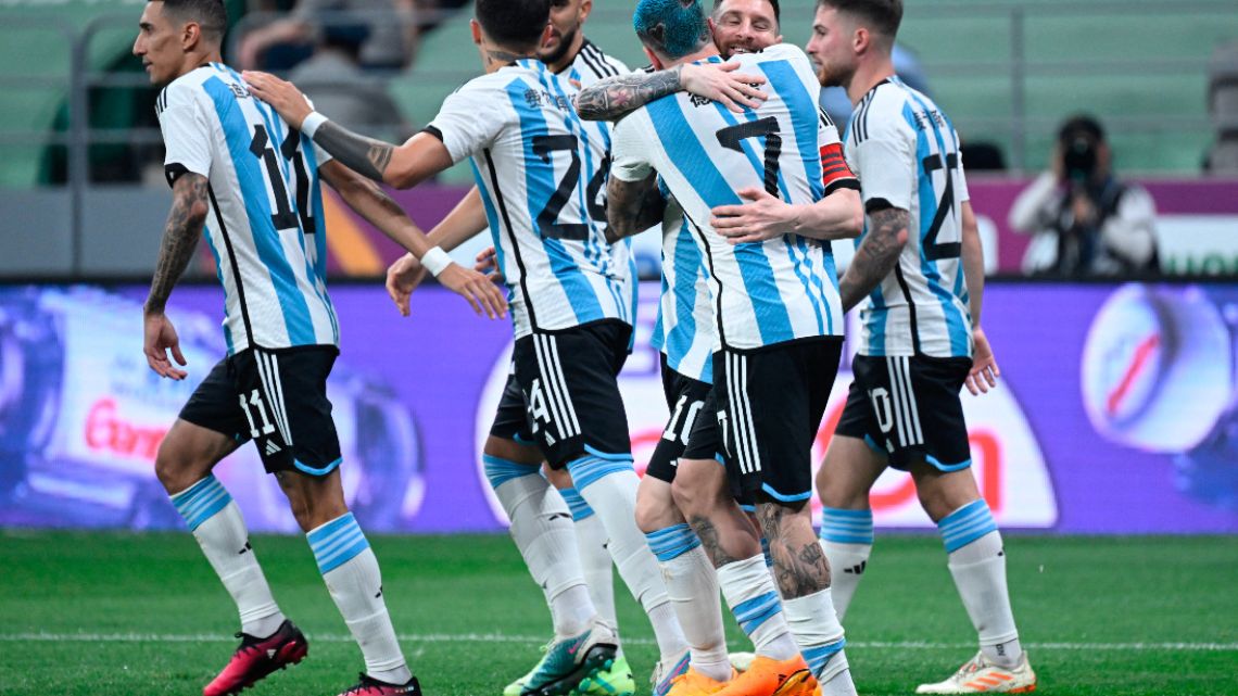 Argentina's Lionel Messi (2R) celebrates with a teammate during a friendly football match against Australia at the Workers' Stadium in Beijing on June 15, 2023.