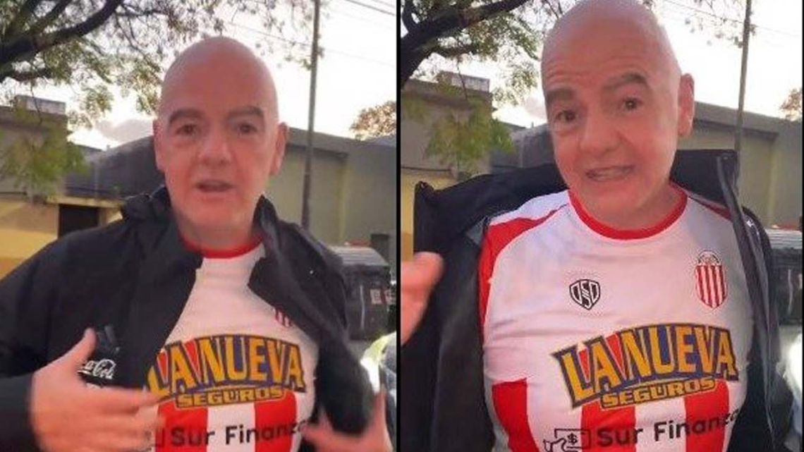 FIFA chief Gianni Infantino shows off his Barracas Central shirt.