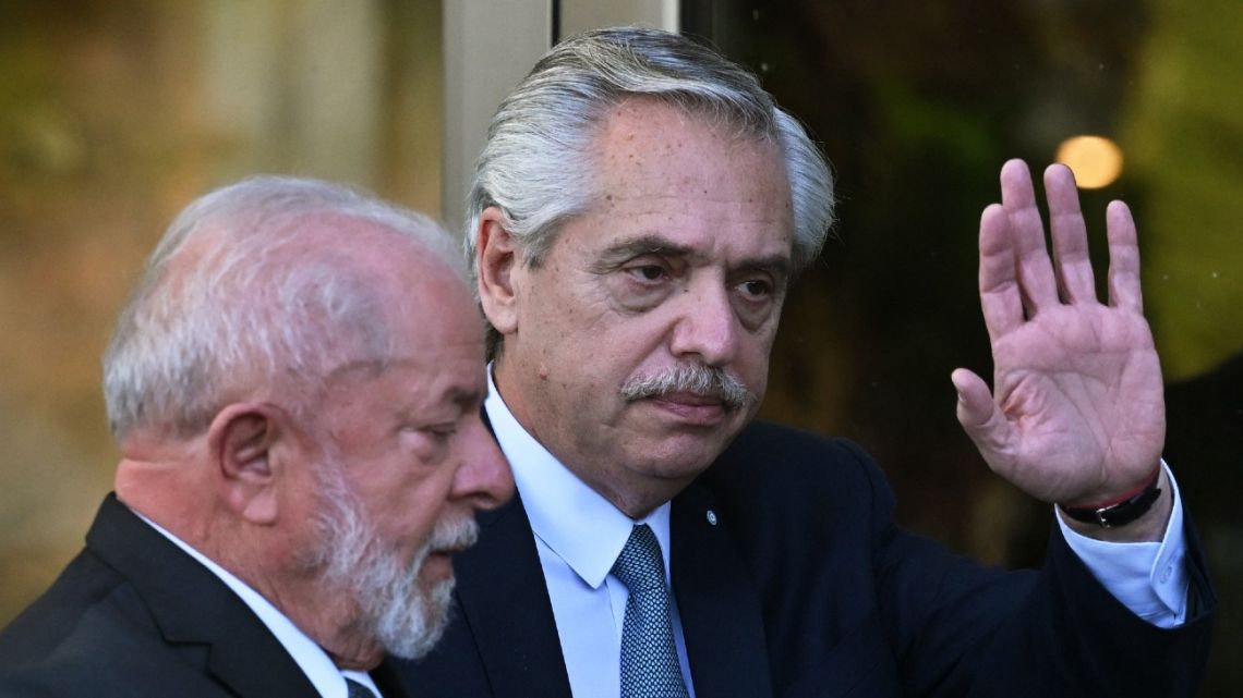 Argentina's President Alberto Fernández and Brazilian President Luiz Inácio Lula da Silva chat after posing for the family picture during the Summit of Heads of State of Mercosur and Associated States in Puerto Iguazú, Argentina on July 4, 2023. 