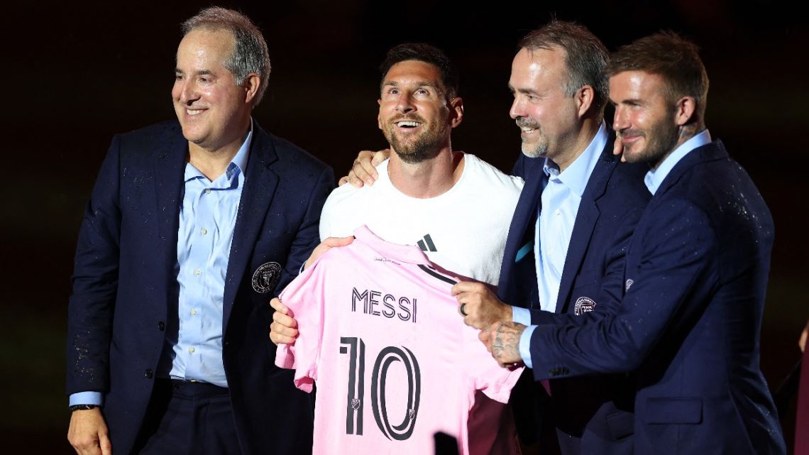  (L-R) Managing Owner Jorge Mas, Lionel Messi, Co-Owner Jose Mas, and Co-Owner David Beckham pose during "The Unveil" introducing Lionel Messi hosted by Inter Miami CF at DRV PNK Stadium on July 16, 2023 in Fort Lauderdale, Florida. 