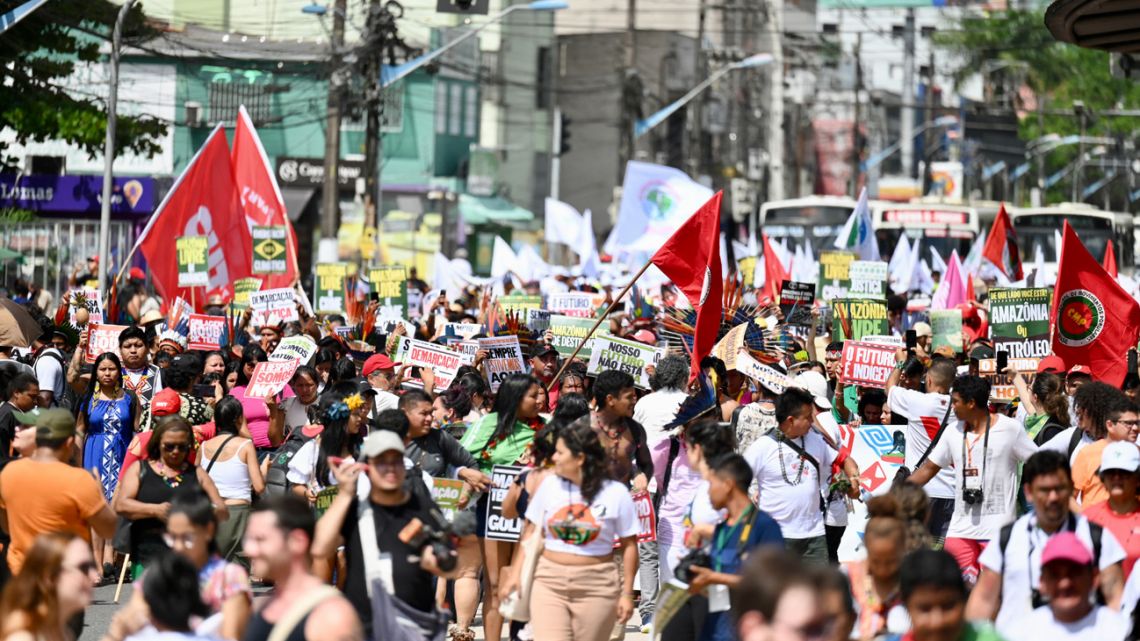 Indigenous people from Amazon countries and members of social movements take part in the March of the Peoples of the Earth for the Amazon in Belém, Pará State, Brazil, on August 8, 2023. 