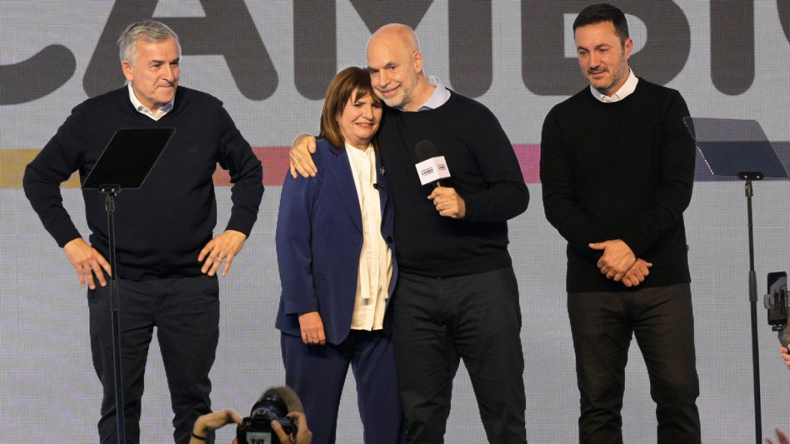 Presidential candidate for the Juntos por el Cambio coalition Patricia Bullrich, accompanied by her running-mate Luis Petri, primary rival Horacio Rodríguez Larreta and his running-mate Gerardo Morales pictured onstage after the primary elections at the Juntos por el Cambio headquarters in Buenos Aires on August 13, 2023. 
