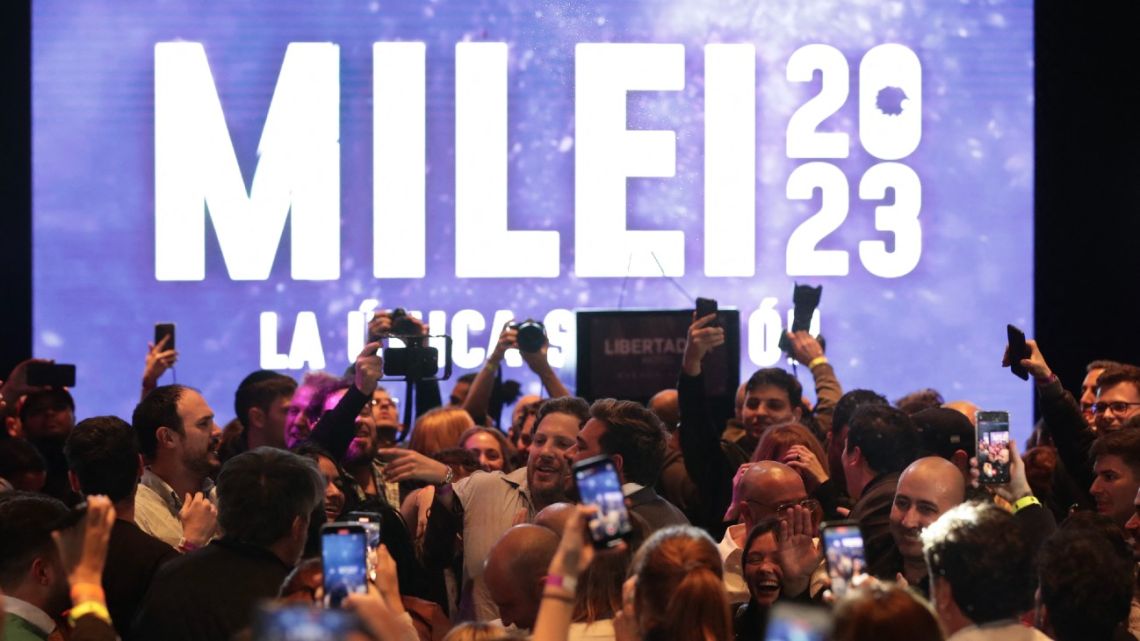 Supporters of presidential candidate Javier Milei celebrate the results of the primary elections at Milei's headquarters in Buenos Aires on August 13, 2023. 