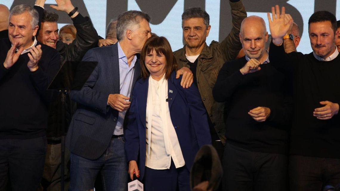 Patricia Bullrich celebrates her PASO primary win as Horacio Rodríguez Larreta looks on.
