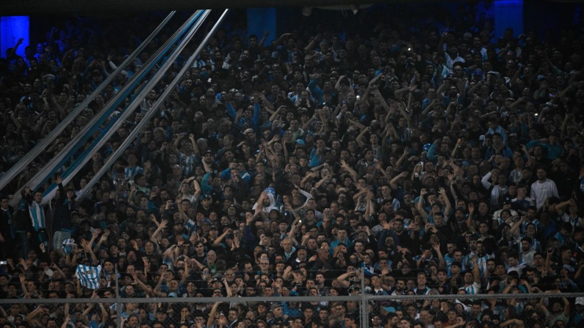 Fans of Racing cheer for their team during the Copa Libertadores round of 16 second leg football match between Argentina's Racing Club and Colombia's Atletico Nacional, at the Presidente Juan Domingo Peron (El Cilindro) stadium, in Buenos Aires, on August 10, 2023. 