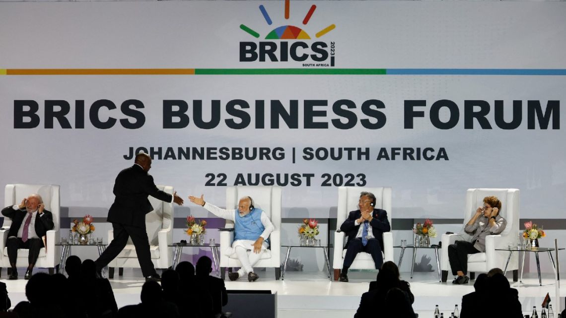(From L to R) President of Brazil Luiz Inacio Lula da Silva, South African President Cyril Ramaphosa, Prime Minister of India Narendra Modi and China's Minister of Commerce Wang Wentao, Former President of Brazil and chair of the New Development Bank Dilma Rousseff attend the 2023 BRICS Summit at the Sandton Convention Centre in Johannesburg on August 22, 2023. 