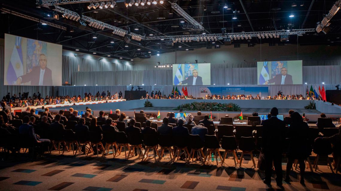 A screen shows the President of Argentina Alberto Fernández delivering remarks at a meeting during the 2023 BRICS Summit at the Sandton Convention Centre in Johannesburg on August 24, 2023.