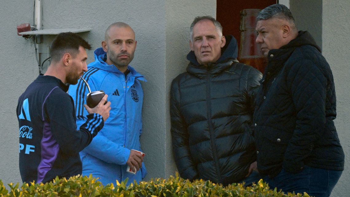 Argentina captain Lionel Messi, drinks mate next to Under-23 coach Javier Mascherano, Sports Marketing chief for Adidas Argentina Roberto Gortari, and AFA's President Claudio Tapia as they chat during a training session in Ezeiza, Buenos Aires Province, on September 5, 2023, ahead of FIFA World Cup 2026 qualifier football matches against Ecuador on September 7 in Buenos Aires and with Bolivia on September 12 in La Paz. 