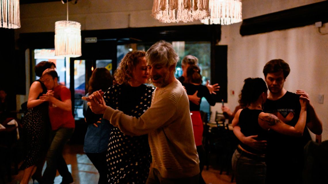 Couples dance tango at the La Tierra Invisible tango night club in Buenos Aires, Argentina, on September 1, 2023.