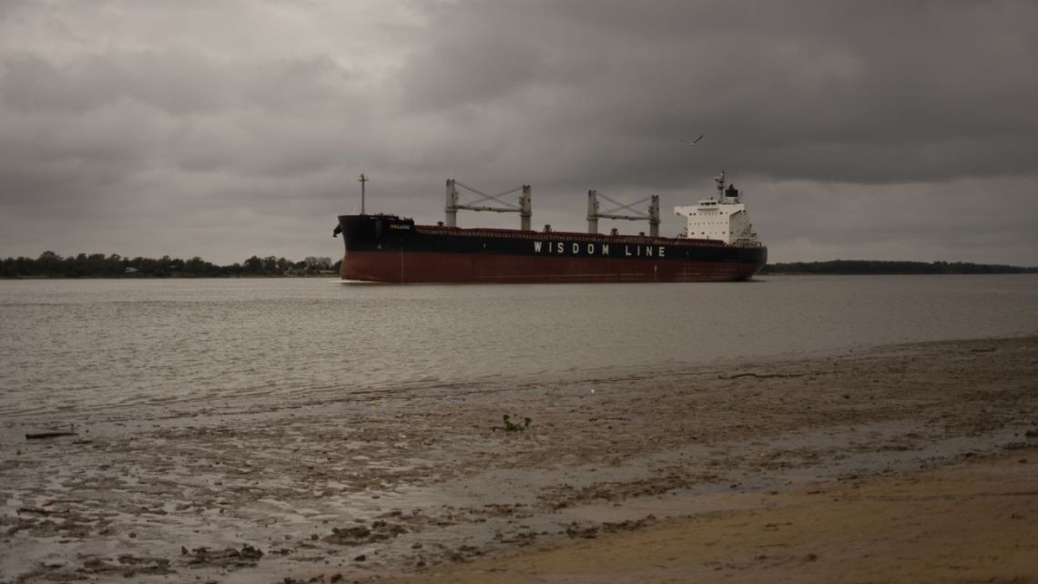 A cargo ship travels on the Paraná River during low water levels in Rosario, Argentina, on Wednesday, June 23, 2021.