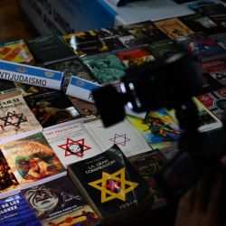 Argentine police seized more than 200 Nazi-oriented publications and book covers from an irregular printing press set up in a house in a Buenos Aires suburb and arrested its owner, authorities said Wednesday. 