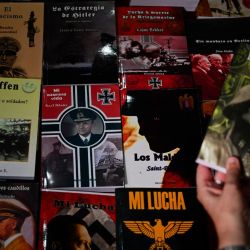 Argentine police seized more than 200 Nazi-oriented publications and book covers from an irregular printing press set up in a house in a Buenos Aires suburb and arrested its owner, authorities said Wednesday. 