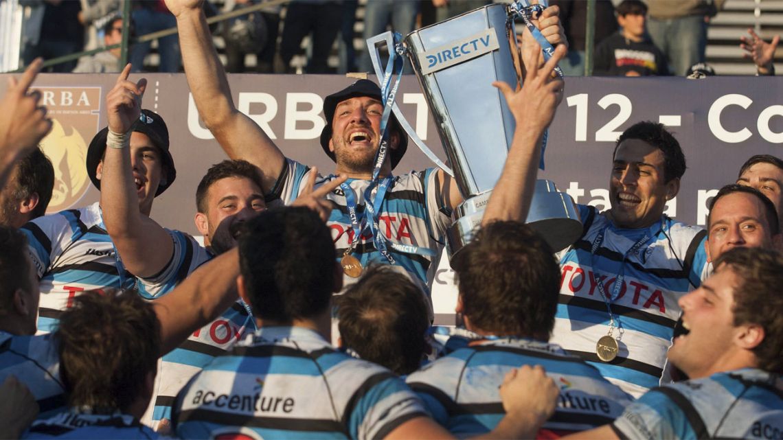 San Isidro Club (SIC) celebrate winning a domestic rugby championship.