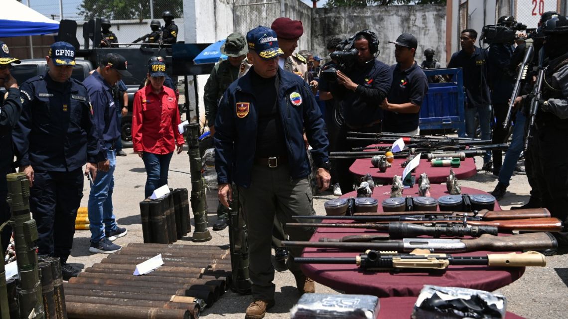 General Remigio Ceballos inspects confiscated weapons and ammunition during a press conference after authorities seized control of the prison in Tocoron, Aragua State, Venezuela, on September 21, 2023.