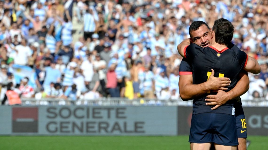 Argentina's left wing Mateo Carreras hugs teammate hooker Agustín Creevy after winning the France 2023 Rugby World Cup Pool D match between Japan and Argentina at the Stade de la Beaujoire in Nantes, western France on October 8, 2023. 