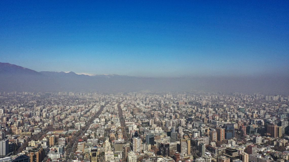 Aerial view of the city of Santiago showing the smog caused by high temperatures, taken on August 2, 2023.