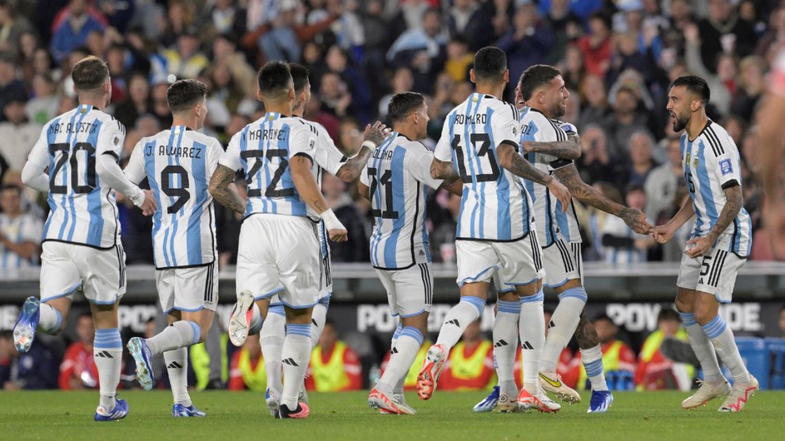 Argentina's defender Nicolás Otamendi celebrates with teammates after scoring during the 2026 FIFA World Cup South American qualification football match between Argentina and Paraguay at the Mas Monumental stadium in Buenos Aires, on October 12, 2023. 