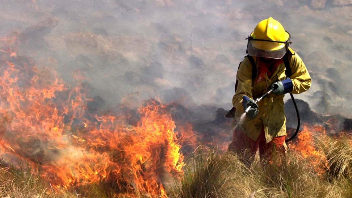 A firefighter tackles forest fires in Córdoba Province.