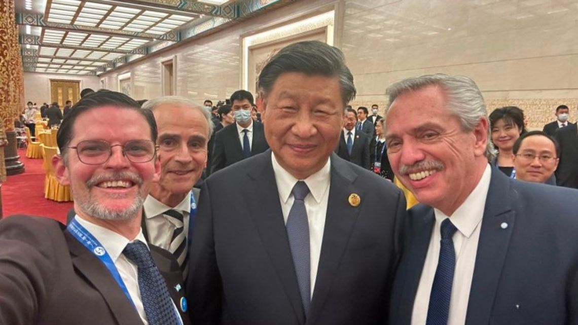 Argentina's Ambassador to China Sabino Vaca Narvaja and President Alberto Fernández share a selfie with Chinese premier Xi Jinping in Beijing.