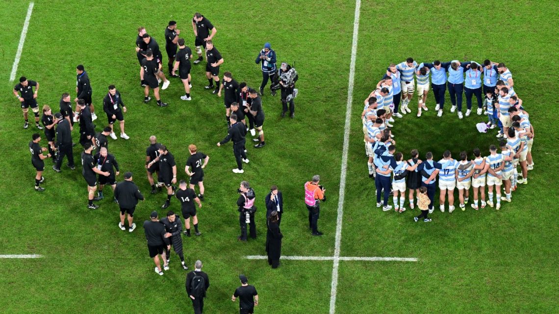 Argentina's players (right) huddle after the France 2023 Rugby World Cup semi-final match between Argentina and New Zealand at the Stade de France in Saint-Denis, on the outskirts of Paris, on October 20, 2023. 