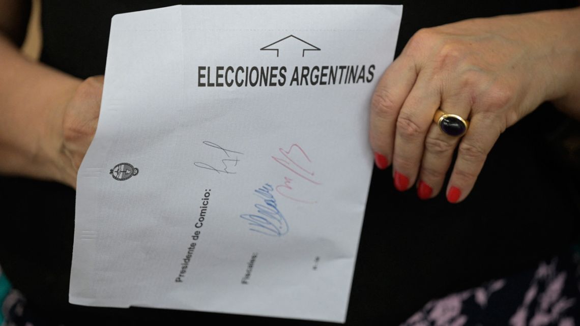 A woman votes at a polling station in Buenos Aires during the presidential election on October 22, 2023.