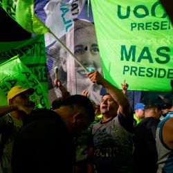 Peronist voters celebrate during an election night rally in Buenos Aires. 
