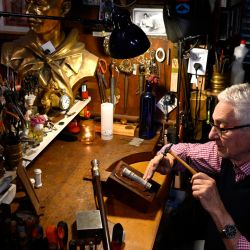 Craftsman Juan Carlos Pallarols, pictured at his workshop in Buenos Aires on November 1. He displays a model presidential baton, like the one that will be given to Argentina’s next president on December 10. 